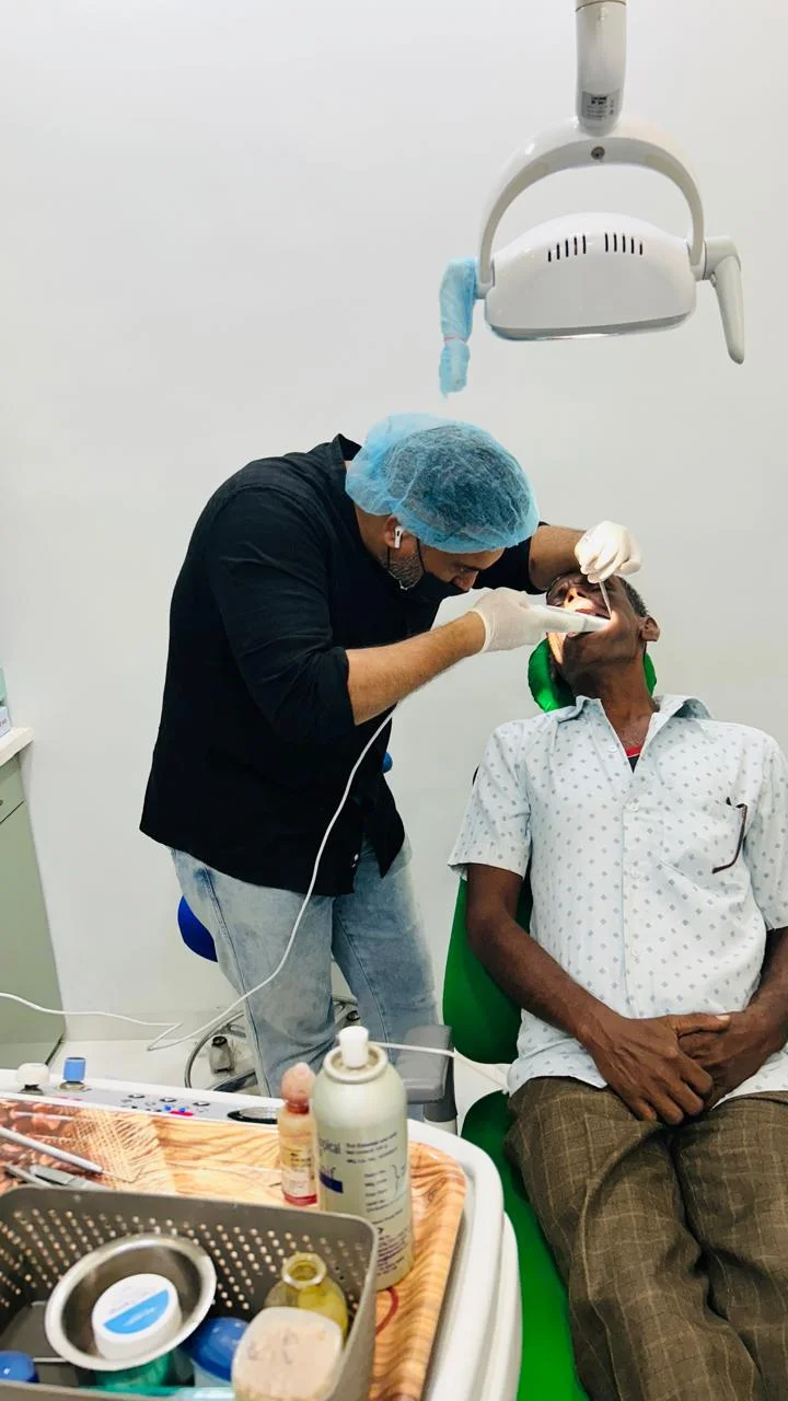 Dr. Wasim performing dental treatment